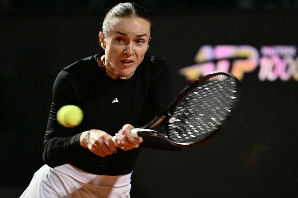 Ukraine's Elina Svitolina hits a return to Poland's Iga Swiatek during the WTA Rome Open tennis tournament at Foro Italico in Rome on May 14, 2026. Filippo MONTEFORTE / AFP