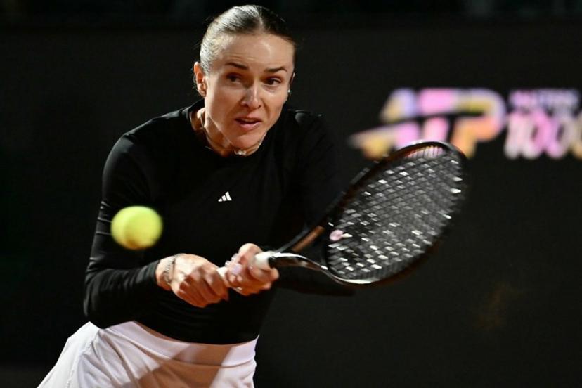 Ukraine's Elina Svitolina hits a return to Poland's Iga Swiatek during the WTA Rome Open tennis tournament at Foro Italico in Rome on May 14, 2026. Filippo MONTEFORTE / AFP