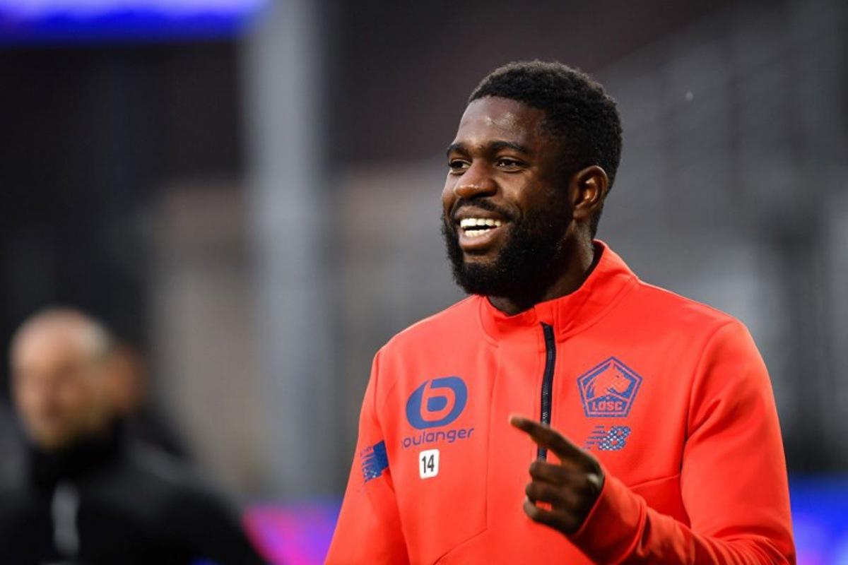 Lille's French defender #14 Samuel Umtiti smiles during the warm up ahead of the French L1 football match between Clermont Foot 63 and Lille LOSC at the Gabriel-Montpied stadium in Clermont-Ferrand, central France, on December 10, 2023. ARNAUD FINISTRE / AFP