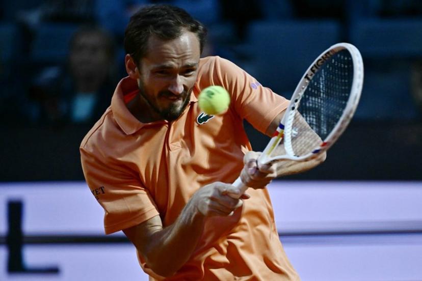 Russia's Daniil Medvedev hits a return to Spain's Martin Landaluce during the ATP Rome Open tennis tournament at Foro Italico in Rome on May 14, 2026. Filippo MONTEFORTE / AFP