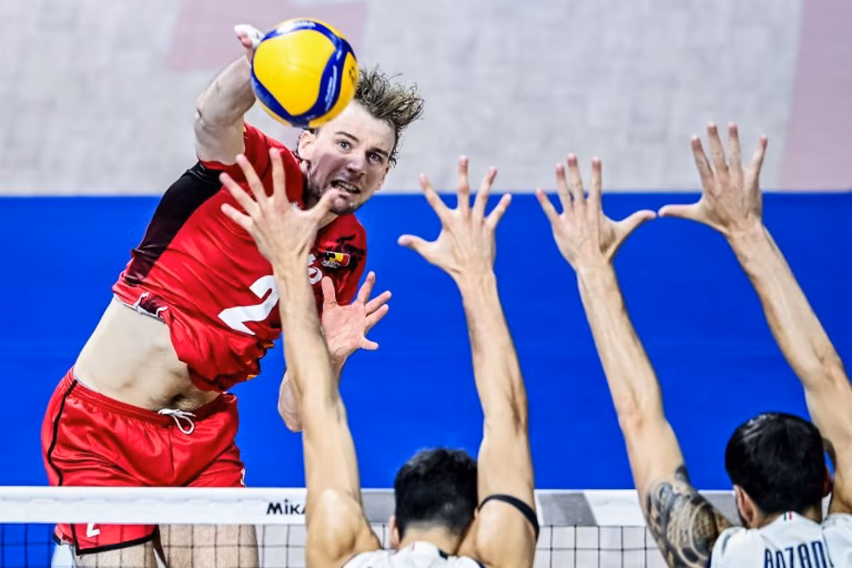 Belgium's Ferre Reggers attempts to score against Italy during the 2025 Men's Volleyball World Championship at the Araneta Coliseum in Quezon City on September 16, 2025. SHERWIN VARDELEON / AFP