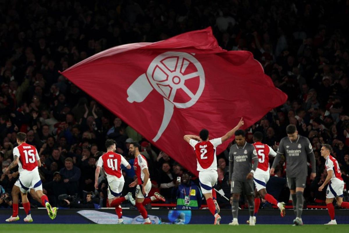 Arsenal's Spanish midfielder #23 Mikel Merino (centre right) celebrates scoring the team's third goal during the UEFA Champions League Quarter final first leg football match between Arsenal and Real Madrid, at the Emirates Stadium, in London, on April 8, 2025. Adrian Dennis / AFP