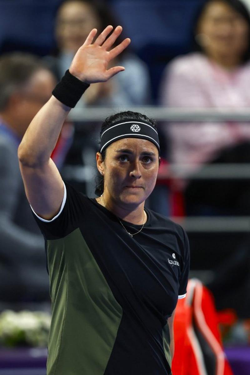Ons Jabeur of Tunisia greets supporters after winning against McCartney Kessler of the USA during their 2025 WTA Qatar Open match at the Khalifa International Tennis Complex in Doha on February 10, 2025. KARIM JAAFAR / AFP
