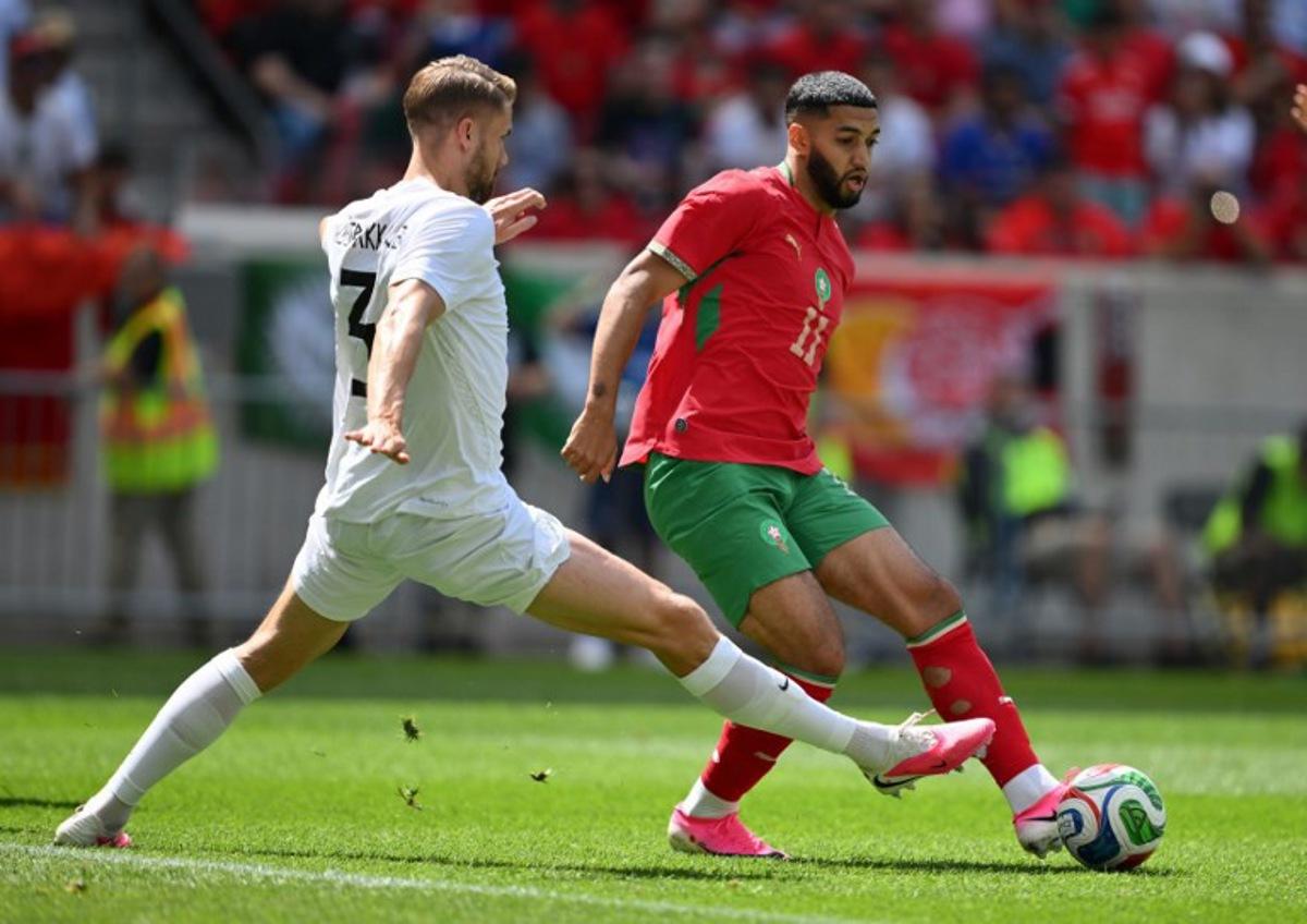 Morocco's midfielder #11 Ismael Saibari is challenged by Norway's defender #3 Kristoffer Ajer during the international friendly football match between Morocco and Norway at Sports Illustrated Stadium in Harrison, New Jersey, on June 7, 2026. ANGELA WEISS / AFP