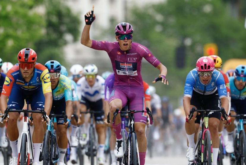 Soudal Quick-Step French rider Paul Magnier wearing the points classification mauve jersey (Maglia Ciclamino) celebrates as he crosses the finish line to win the 3nd stage of the Giro d'Italia 2026 - Tour of Italy cycling race between Plovdiv and Sofia, Bulgaria, on May 10, 2026. Luca Bettini / AFP