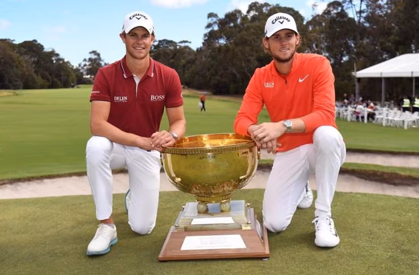Thomas Detry (L) and Thomas Pieters (R) of Belgium celebrate with the trophy after winning the World Cup of Golf at the Metropolitan Golf Club in Melbourne on November 25, 2018. William WEST / AFP -- IMAGE RESTRICTED TO EDITORIAL USE - STRICTLY NO COMMERCIAL USE --