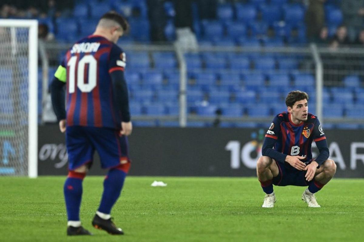 FC Basel's players react at the end of the UEFA Europa League - League phase, Matchday 8 - football match between FC Basel 1893 and FC Viktoria Plzen at St Jakob-Park stadium in Basel on January 29, 2026. SEBASTIEN BOZON / AFP