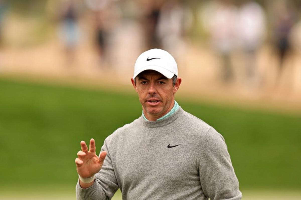 Rory McIlroy of Northern Ireland gestures after playing a shot on the 3rd hole during the Hero Dubai Desert Classic golf tournament at the Emirates Golf Club in Dubai on January 25, 2026. Fadel SENNA / AFP