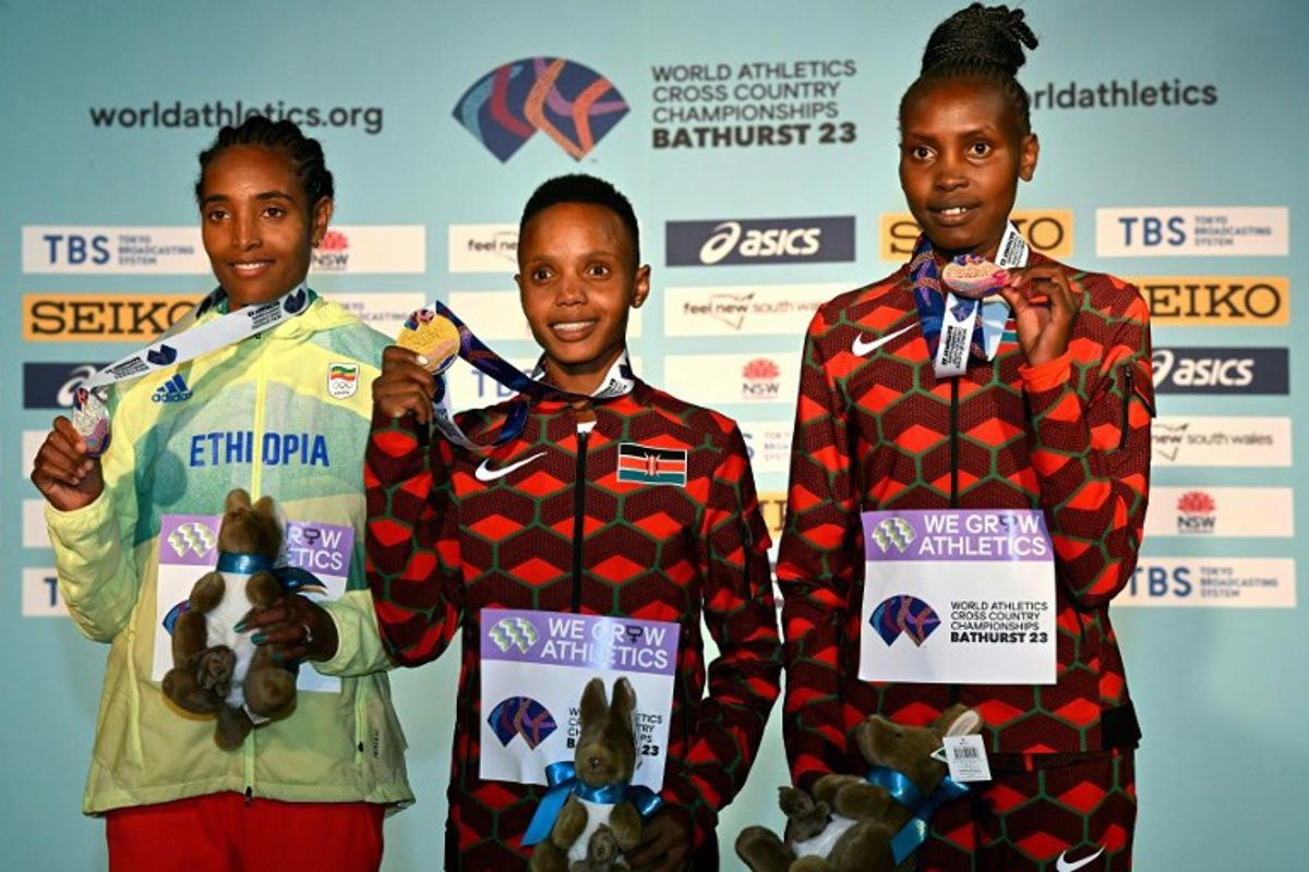Women's senior race winners, gold medallist Beatrice Chebet of Kenya (C), silver medallist Tsigie Gebreselama of Ethiopia (L) and bronze medalist Agnes Jebet Ngetich of Kenya (R) pose with their medals after the 2023 World Cross Country Championships at Mount Panorama in Bathusrt on February 18, 2023. Saeed KHAN / AFP