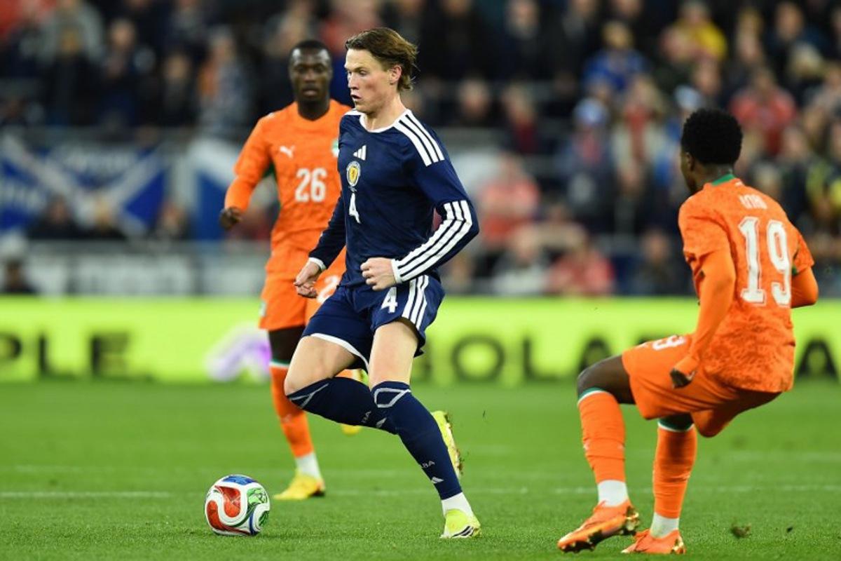 Scotland's midfielder #04 Scott McTominay (C) runs with the ball during the friendly international football match between Scotland and Ivory Coast at the Hill Dickinson Stadium in Liverpool, north west England on March 31, 2026. PETER POWELL / AFP