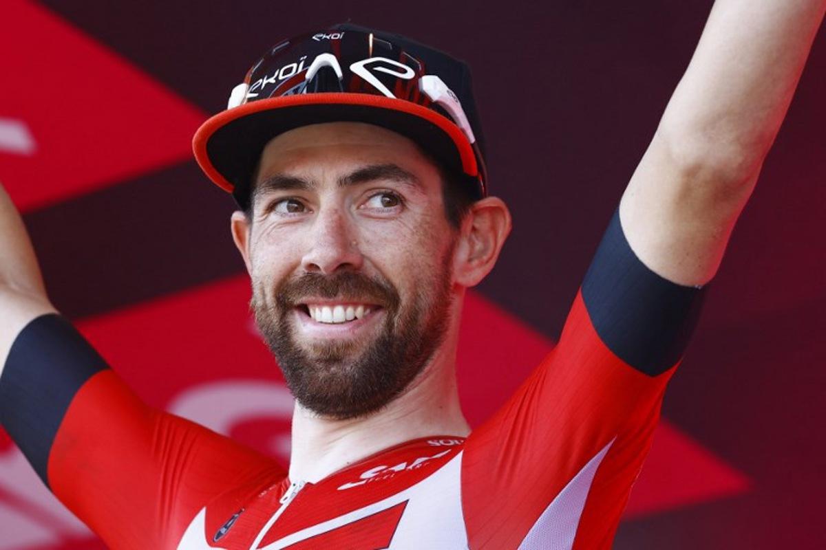Team Lotto's Belgian rider Thomas De Gendt celebrates on the podium after winning the 8th stage of the Giro d'Italia 2022, 153 kilometers between Napoli and Napoli, southwestern Italy, on May 14, 2022. Luca Bettini / AFP