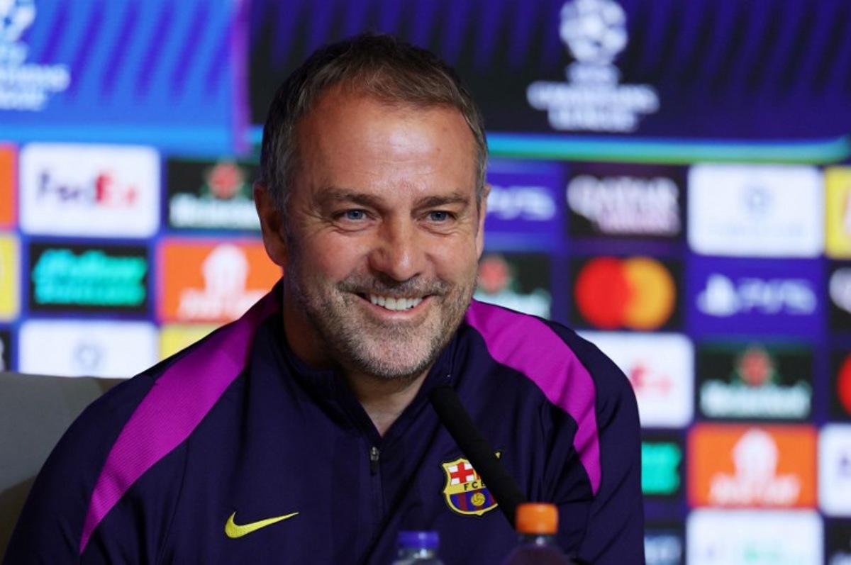 Barcelona's German coach Hans-Dieter Flick gives a press conference on the eve of their UEFA Champions League quarter final second leg football match against Club Atletico de Madrid at Metropolitano Stadium in Madrid, on April 13, 2026. Thomas COEX / AFP