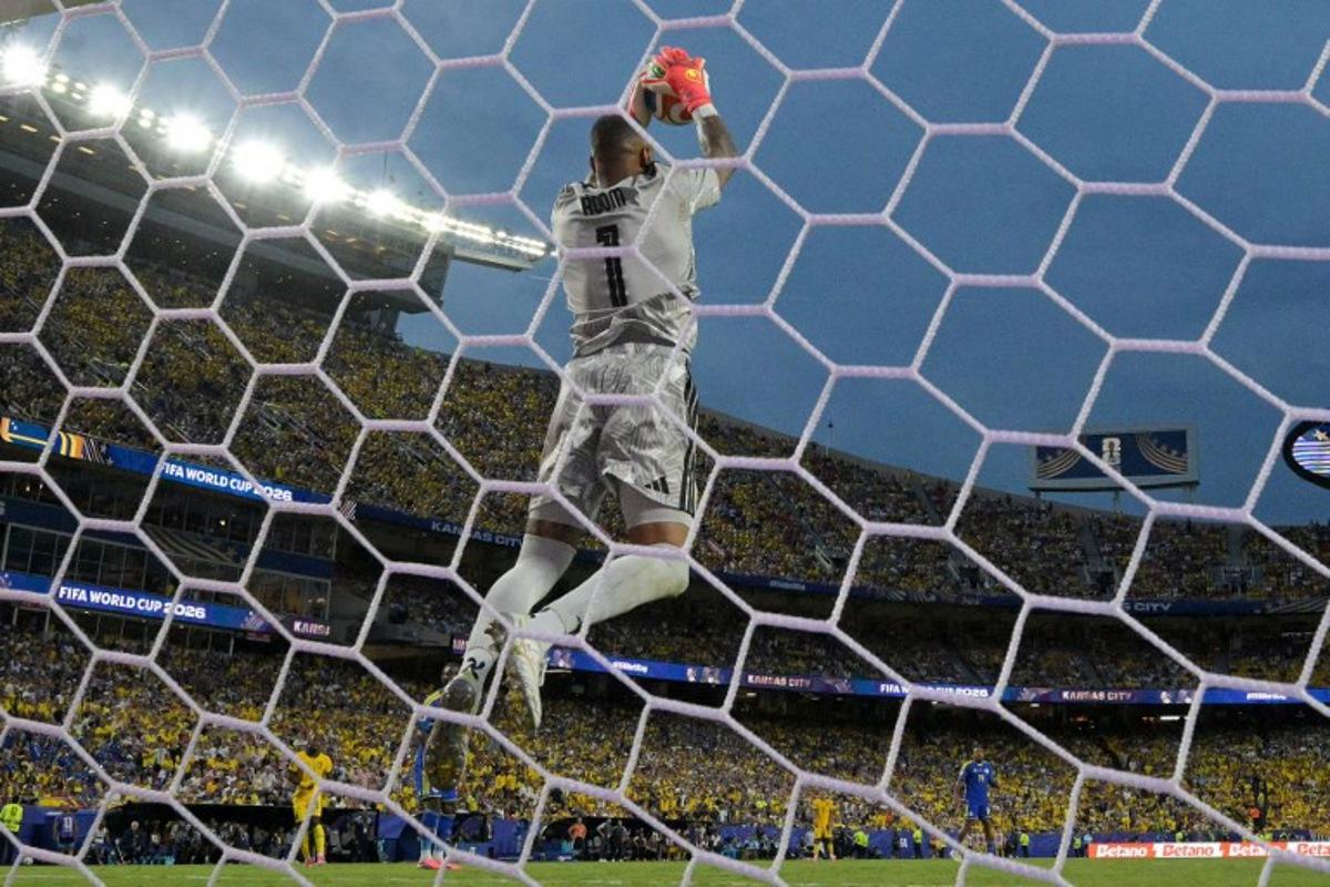 Curacao's goalkeeper #01 Eloy Room makes a save during the 2026 World Cup Group E football match between Ecuador and Curacao at the Kansas City Stadium in Kansas City on June 20, 2026. JUAN MABROMATA / AFP