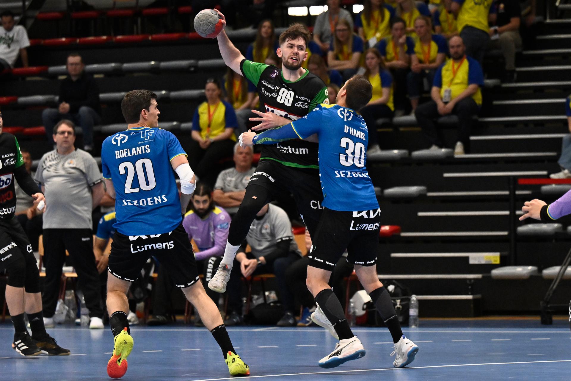 Hubo Hasselt's Jean Dupont and Bocholt's Ilyas D'Hanis fight for the ball during a handball game between Hubo handbal Hasselt and Achilles Bocholt, Saturday 19 April 2025, in Hasselt, the men's final of the Belgian handball cup. BELGA PHOTO JOHAN EYCKENS