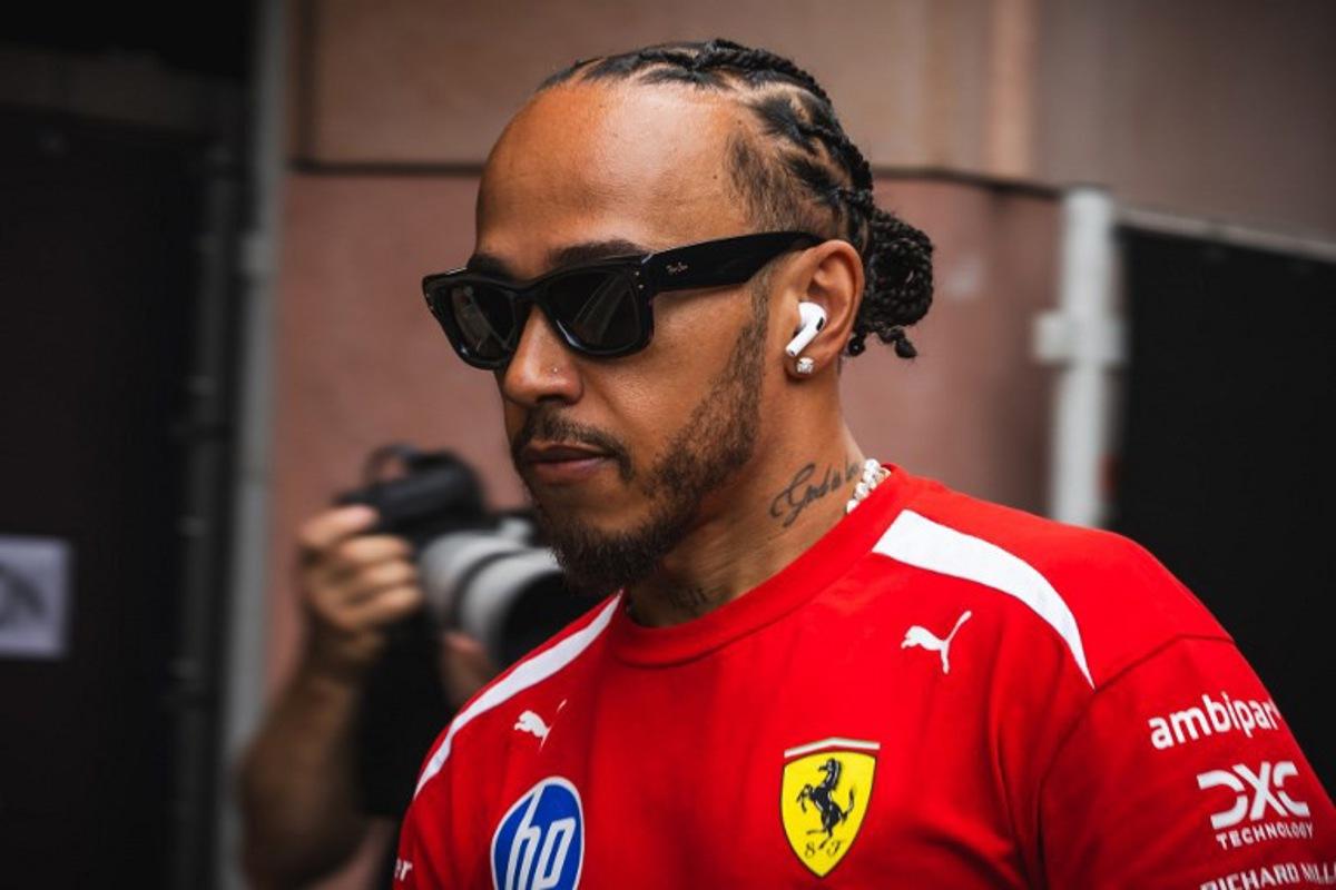 Ferrari's British driver Lewis Hamilton walks down the paddock at the Circuit de Monaco in Monaco, on June 4, 2026, ahead of the Formula One Monaco Grand Prix. Andrej ISAKOVIC / AFP