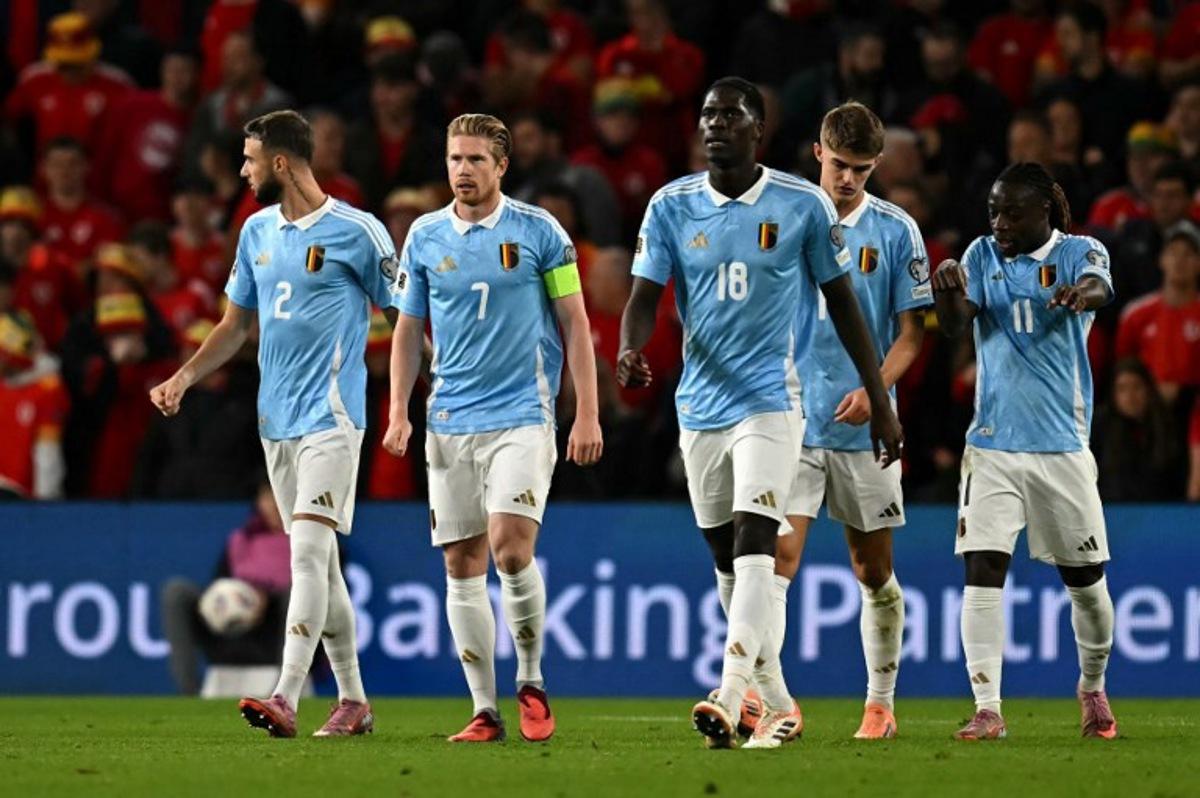 Belgium's midfielder #07 Kevin De Bruyne (2L) looks on after scoring a penalty during the 2026 World Cup Group J qualifier football match between Wales and Belgium, at Cardiff City Stadium, in Cardiff, on October 13, 2025. Paul ELLIS / AFP
