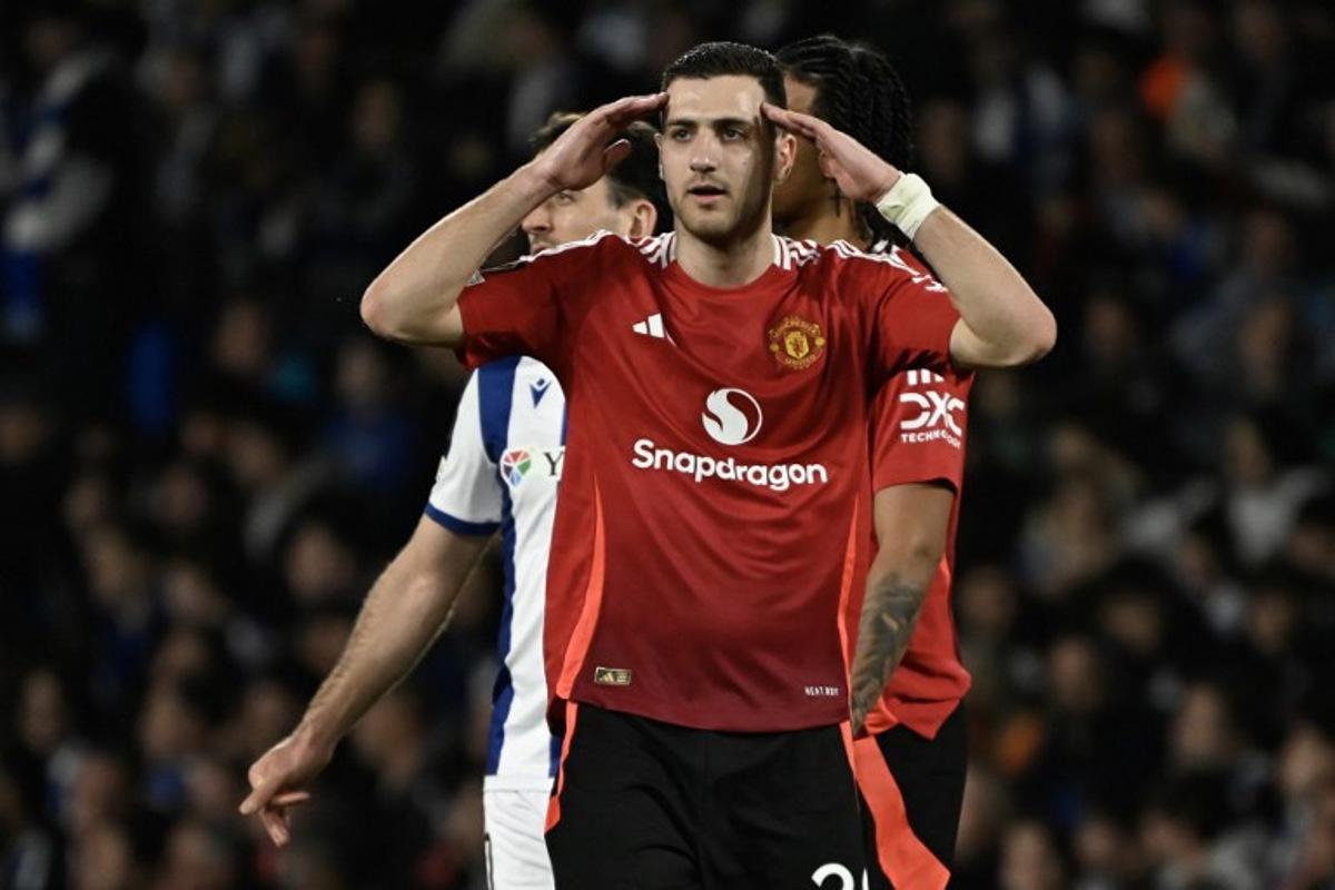 Manchester United's Portuguese defender #20 Diogo Dalot reacts after Real Sociedad was awarded a penalty during the UEFA Europa League Round of 16 first let football match between Real Sociedad and Manchester United at Anoeta Stadium in San Sebastian on March 6, 2025. ANDER GILLENEA / AFP