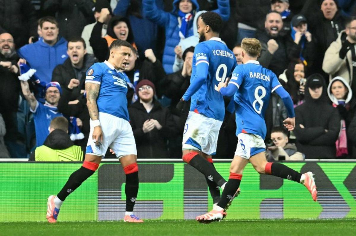 Rangers' English defender #02 James Tavernier celebrates scoring his team's first goal from the penalty spot during the UEFA Europa League league-stage football match between Rangers and CS Braga at the Ibrox Stadium in Glasgow on November 27, 2025. ANDY BUCHANAN / AFP