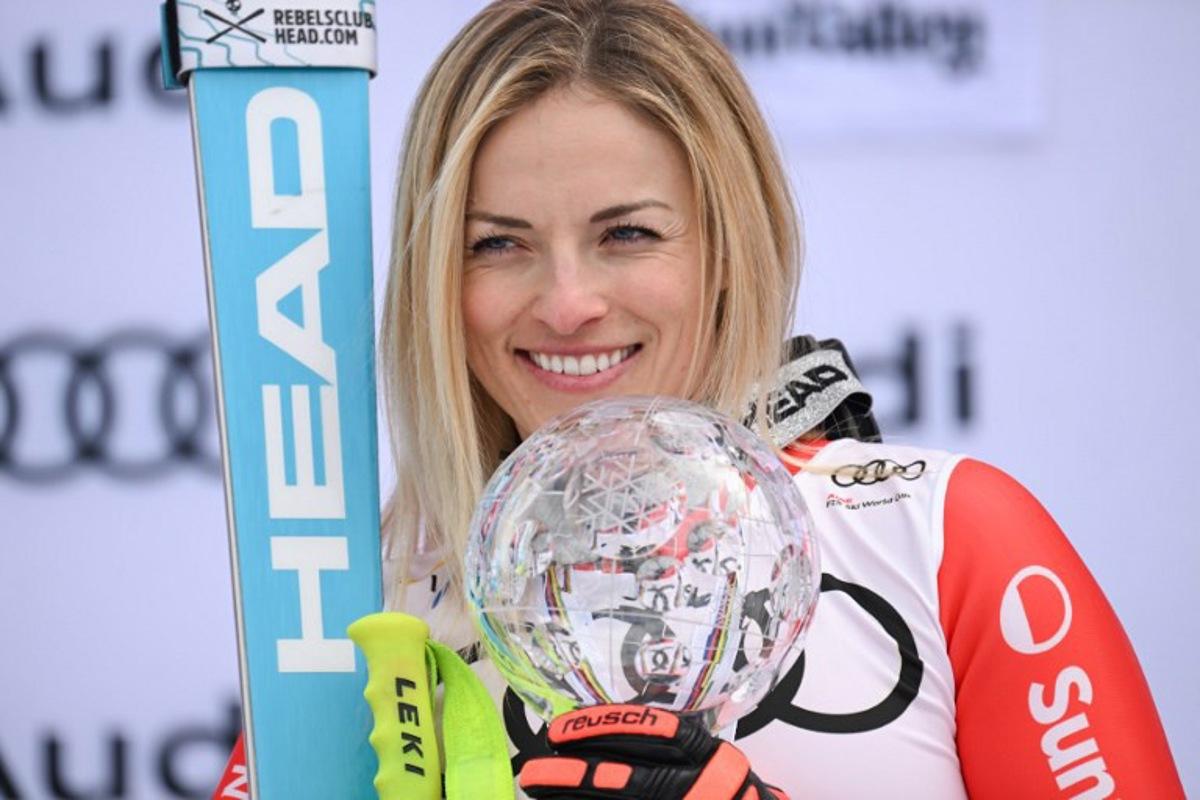 Overall champion Switzerland's Lara Gut-Behrami poses with the Crystal Globe on the podium of the season's overall Super-G winners of the FIS Alpine Skiing Women's World Cup at the Sun Valley Finals in Sun Valley, Idaho on March 23, 2025. Patrick T. Fallon / AFP