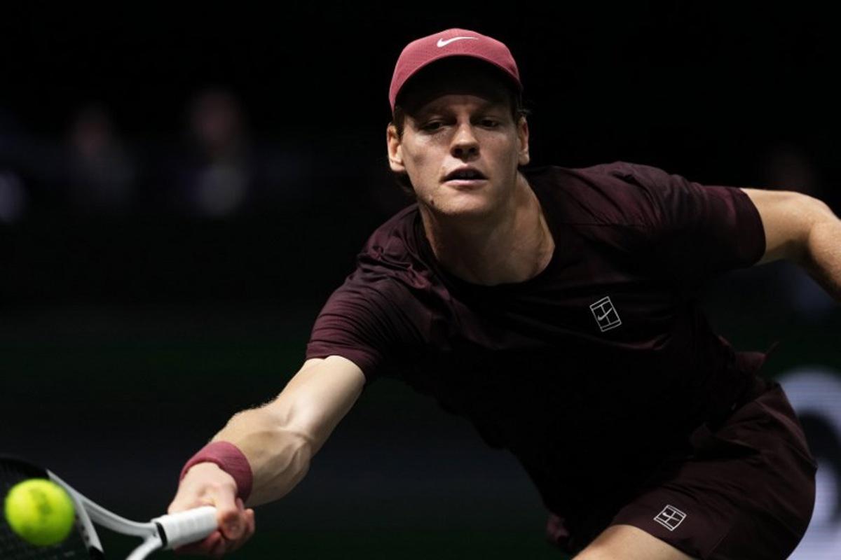 Italy's Jannik Sinner plays a forehand return to Belgium's Zizou Bergs during their men's singles match on day three of the Paris ATP Masters 1000 tennis tournament at the Paris La Défense Arena in Nanterre, on the outskirts of Paris, on October 29, 2025. Dimitar DILKOFF / AFP