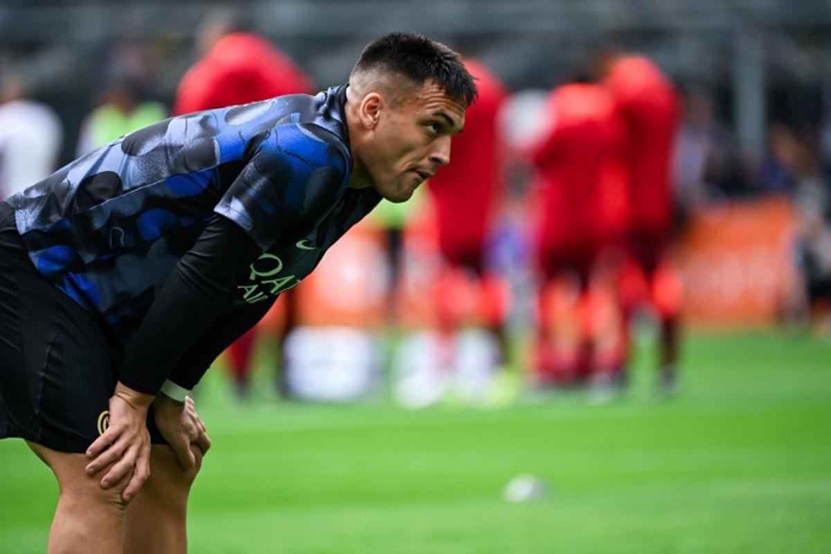 Inter Milan's Argentine forward #10 Lautaro Martinez looks on during the warm up ahead of the Italian Serie A football match between Inter Milan and Roma at the San Siro stadium in Milan on April 27, 2025. Piero CRUCIATTI / AFP