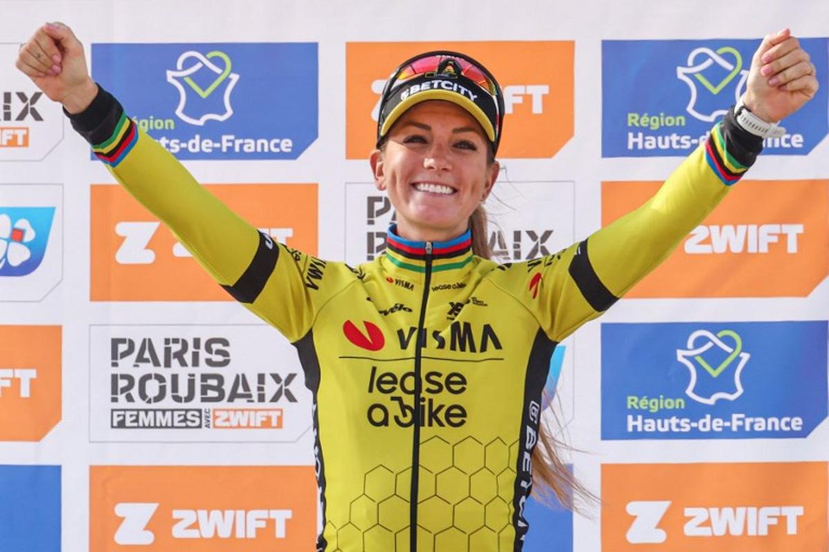 First placed Team Visma-Lease a Bike's French rider Pauline Ferrand Prevot celebrates on the podium of the fifth edition of the Paris-Roubaix women's race, 148,5 km between Denain and Roubaix, northern France on April 12, 2025. Francois LO PRESTI / AFP