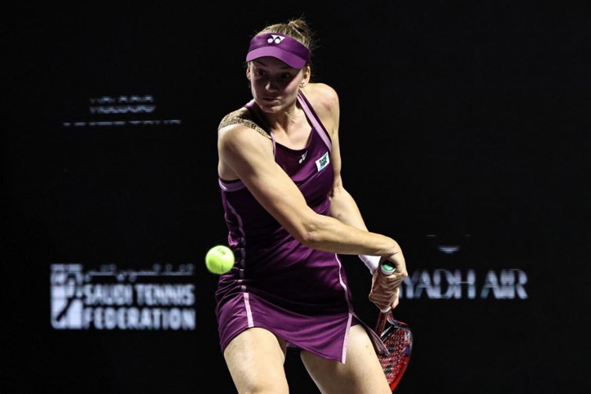 Kazakhstan's Elena Rybakina hits a return against USA's Jessica Pegula during their semi-final tennis match at the WTA Finals in Riyadh on November 7, 2025. Fayez NURELDINE / AFP