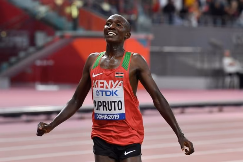 Kenya's Rhonex Kipruto celebrates finishing third in the Men's 10,000m final at the 2019 IAAF Athletics World Championships at the Khalifa International stadium in Doha on October 6, 2019. ANDREJ ISAKOVIC / AFP