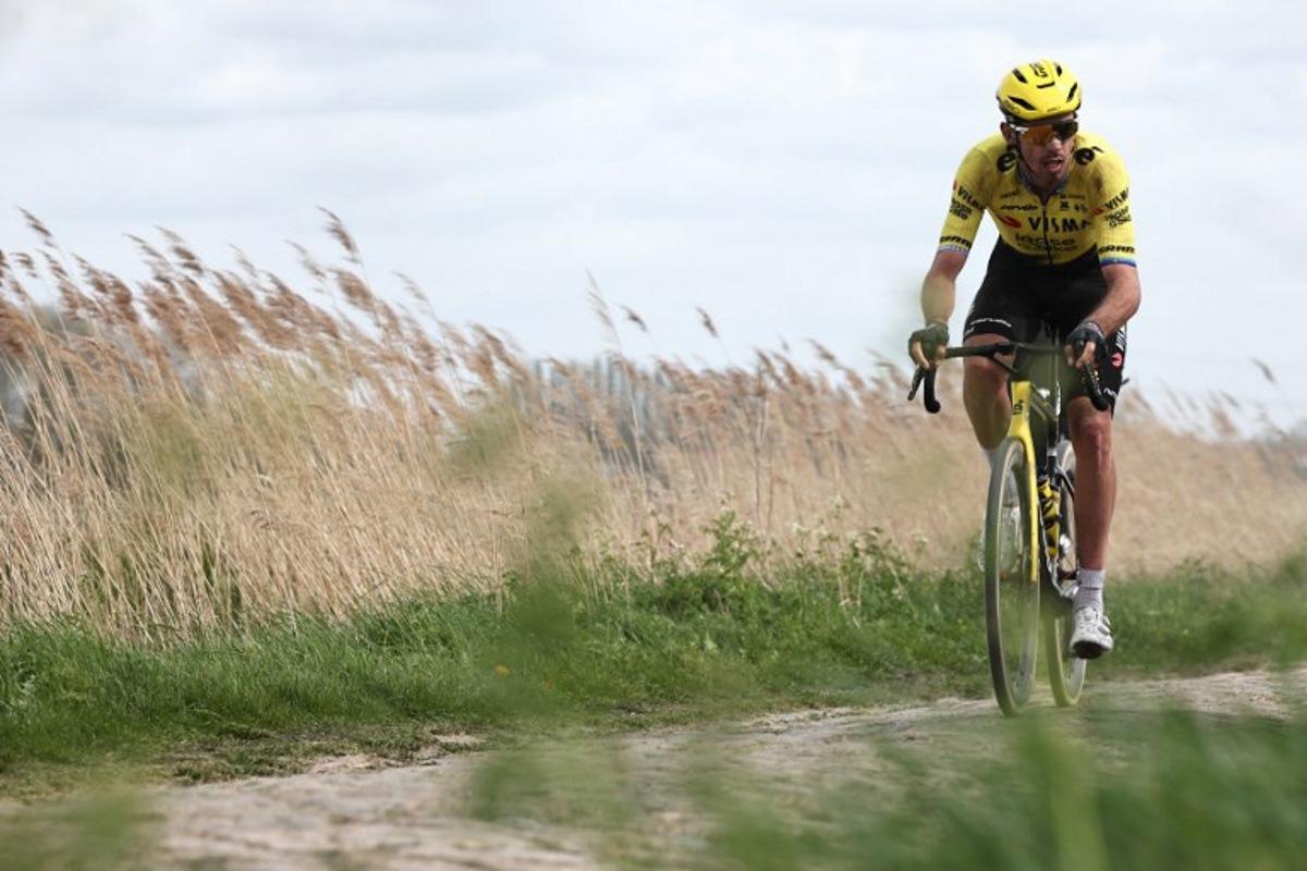 Team Visma - Lease a Bike's French rider Christophe Laporte cycles on a cobblestone sector during the 123rd edition of the Paris-Roubaix one-day classic cycling race, 258.3 km between Compiègne and Roubaix, northern France, on April 12, 2026. Anne-Christine POUJOULAT / AFP