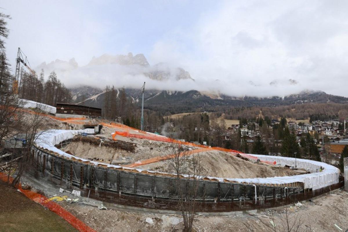 A general view shows the work site of the new Cortina Sliding Centre during its pre-approval testing process ahead of the Olympic Winter Games Milano Cortina 2026, in Cortina on March 25, 2025. Dozens of bobsleigh, luge and skeleton athletes will take to the track in Cortina d'Ampezzo for the first time, carrying out a series of test runs over its 1,749 metres and 16 turns. Pierre TEYSSOT / AFP