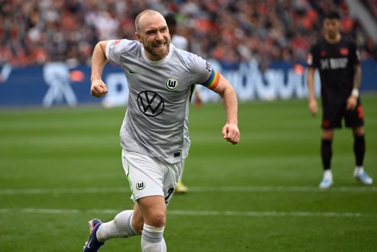 Wolfsburg's Danish midfielder #24 Christian Eriksen celebrates scoring a penalty during the German first division Bundesliga football match between Bayer leverkusen and VfL Wolfsburg in Leverkusen on April 4, 2026. INA FASSBENDER / AFP