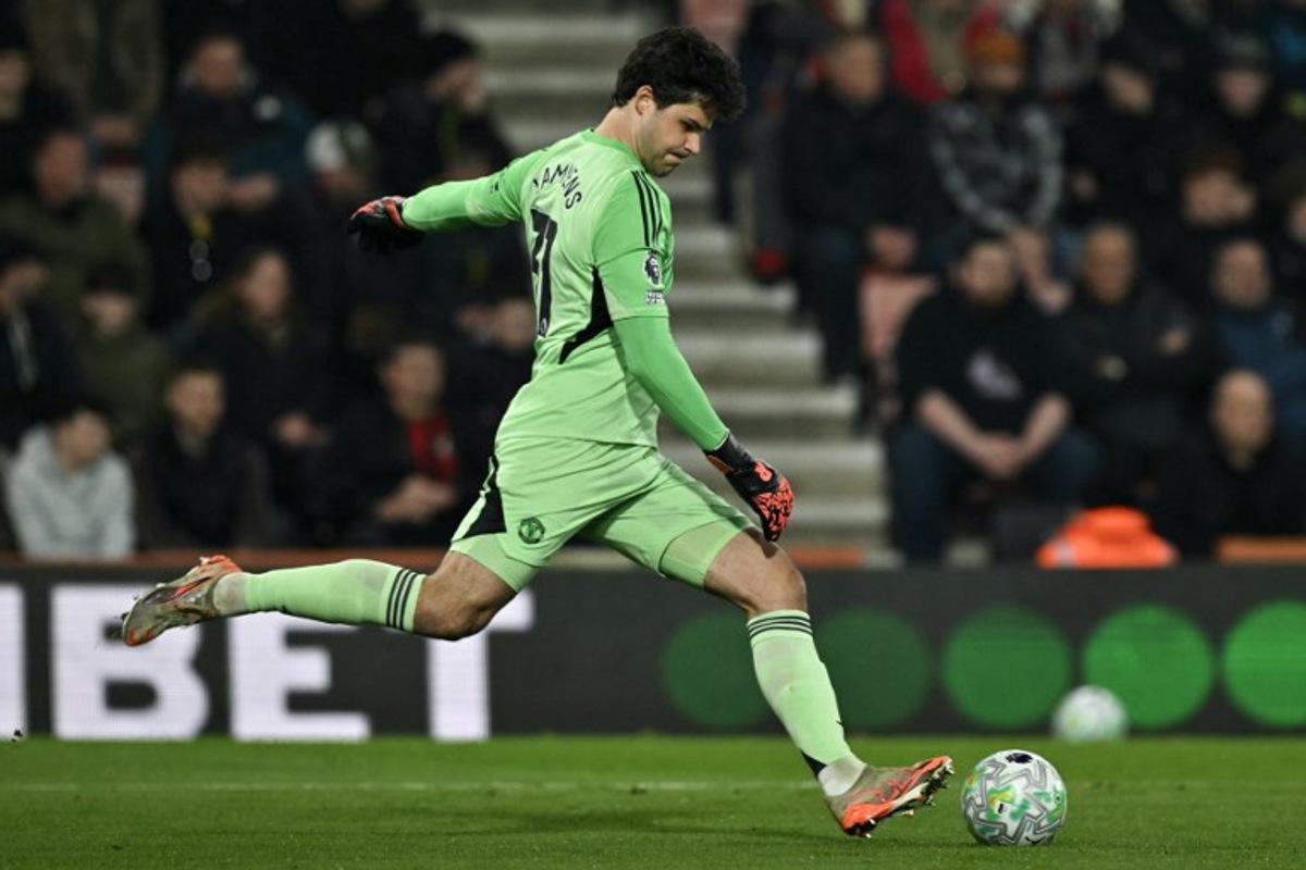 Manchester United's Belgian goalkeeper #31 Senne Lammens clears the ball during the English Premier League football match between Bournemouth and Manchester United at the Vitality Stadium in Bournemouth, southern England on March 20, 2026. Glyn KIRK / AFP