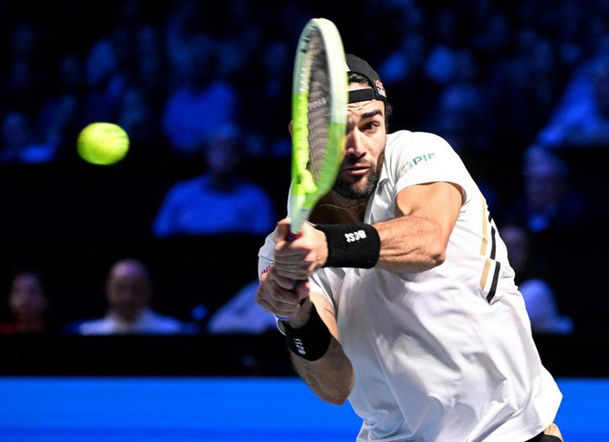 Italy's Matteo Berrettini returns the ball to Australia's Alex de Minaur during their men's quarter-final singles match at the ATP Vienna Open tennis tournament in Vienna, Austria, on October 24, 2025. HELMUT FOHRINGER / APA / AFP