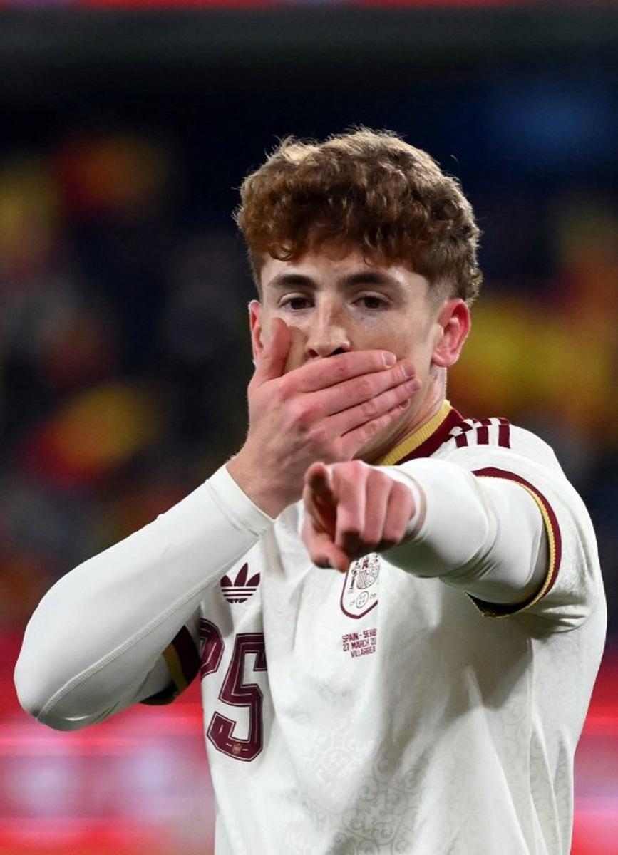 Spain's forward #25 Victor Munoz Villanueva celebrates scoring his team's third goal during the international friendly football match between Spain and Serbia at La Ceramica Stadium in Vila-real on March 27, 2026. JOSE JORDAN / AFP