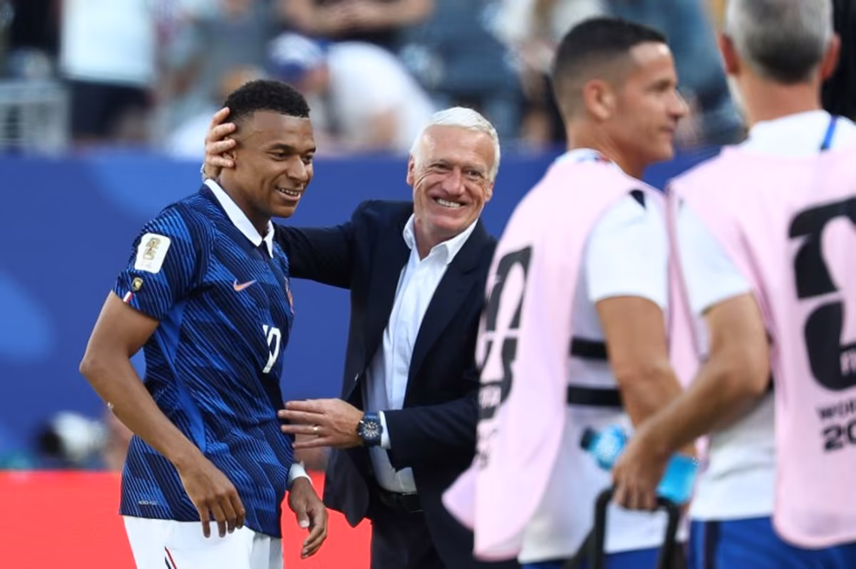France's head coach Didier Deschamps congratulates his forward #10 Kylian Mbappe after scoring his team's first goal during the 2026 World Cup Group I football match between France and Senegal at the New York/New Jersey Stadium in East Rutherford on June 16, 2026. FRANCK FIFE / AFP