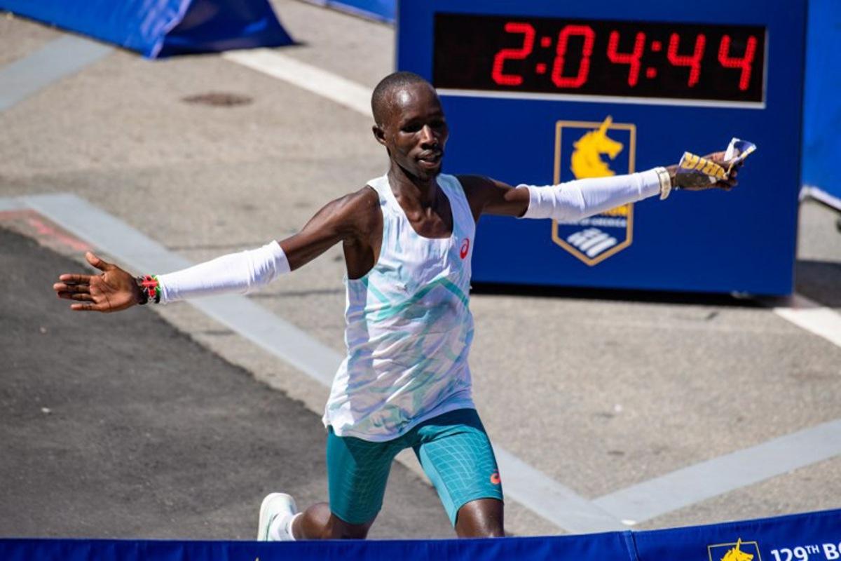 Kenyan distance runner John Korir crosses the finish line as he wins the men's race during the 129th Boston Marathon on April 21, 2025, in Boston, Massachusetts. The marathon includes around 30,000 athletes from 129 countries running the 26.2 miles from Hopkinton to Boston, Massachusetts. The event is the world's oldest annually run marathon. Joseph Prezioso / AFP