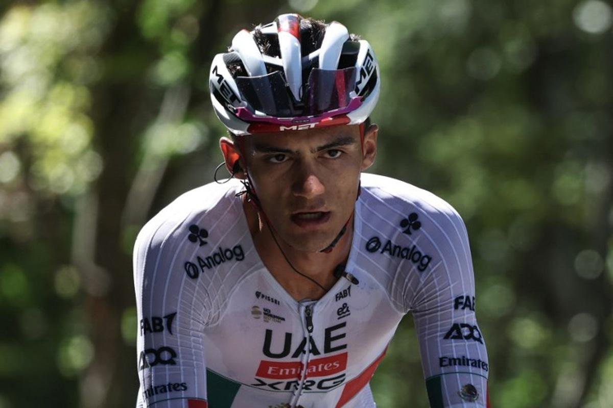 UAE Team Emirates XRG's Mexican rider Isaac Del Toro Romero cycles in a breakaway during the 8th and final stage of the Tour Auvergne-Rhone-Alpes cycling race (formerly known as the Criterium du Dauphine), 120,1km between Beaufort and Plateau de Solaison, in the French Alps on June 14, 2026. Anne-Christine POUJOULAT / AFP