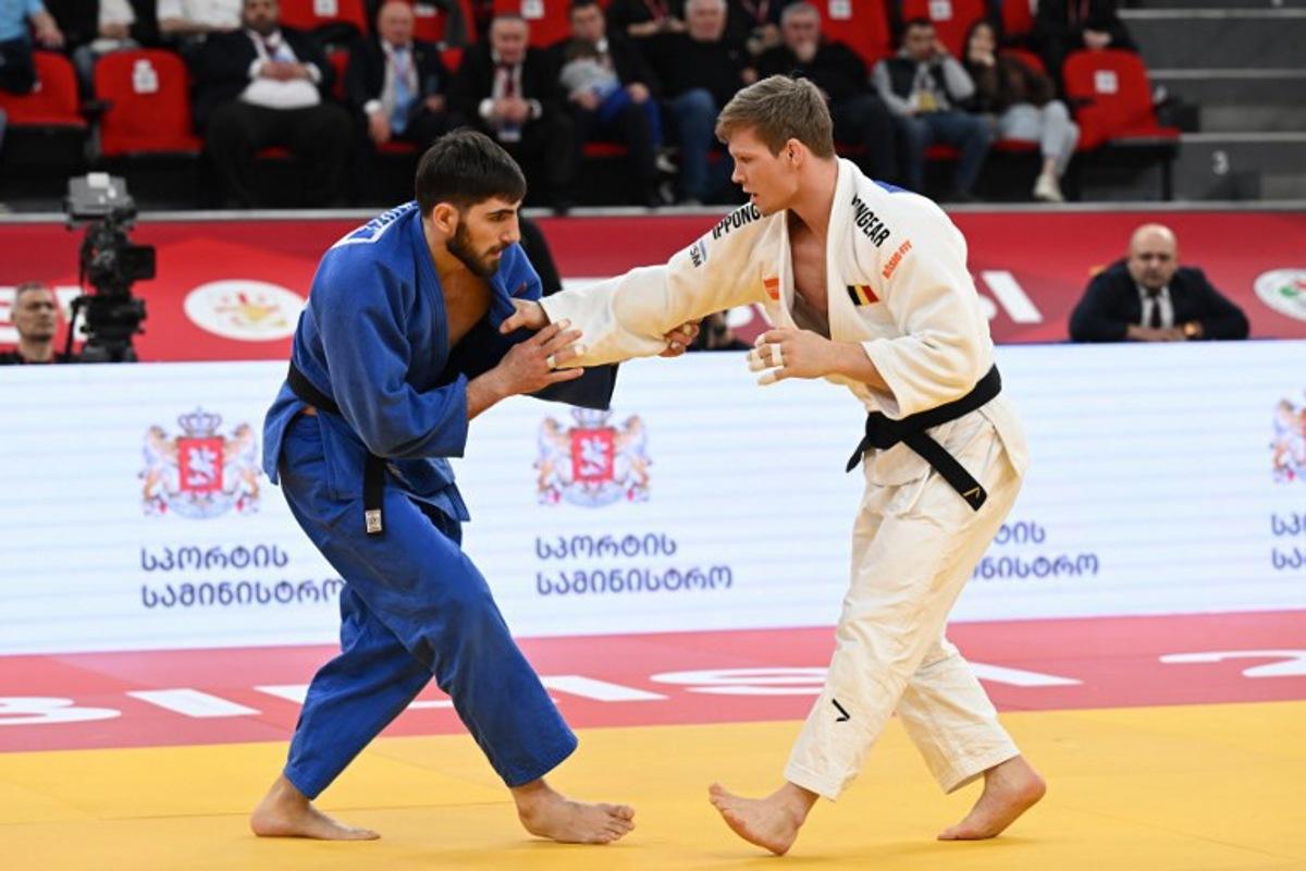 Belgium's Matthias Casse (white) competes against Georgia's Dimitri Gochilaidze in the men's under 81 kg bronze medal bout at the Tbilisi Grand Slam judo tournament in Tbilisi on March 21, 2026. Vano SHLAMOV / AFP