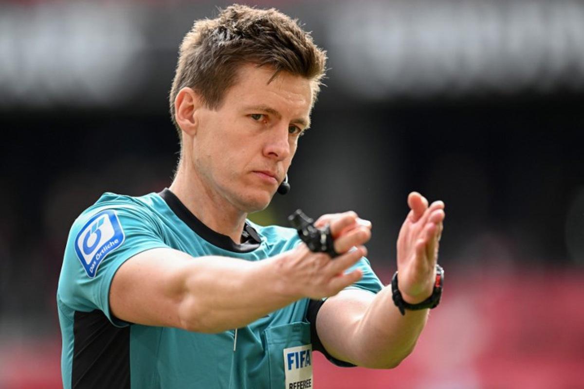 German referee Daniel Siebert reacts during the German first division Bundesliga football match between SC Freiburg and FC Bayern Munich in Freiburg, southern Germany on April 4, 2026. Silas STEIN / AFP