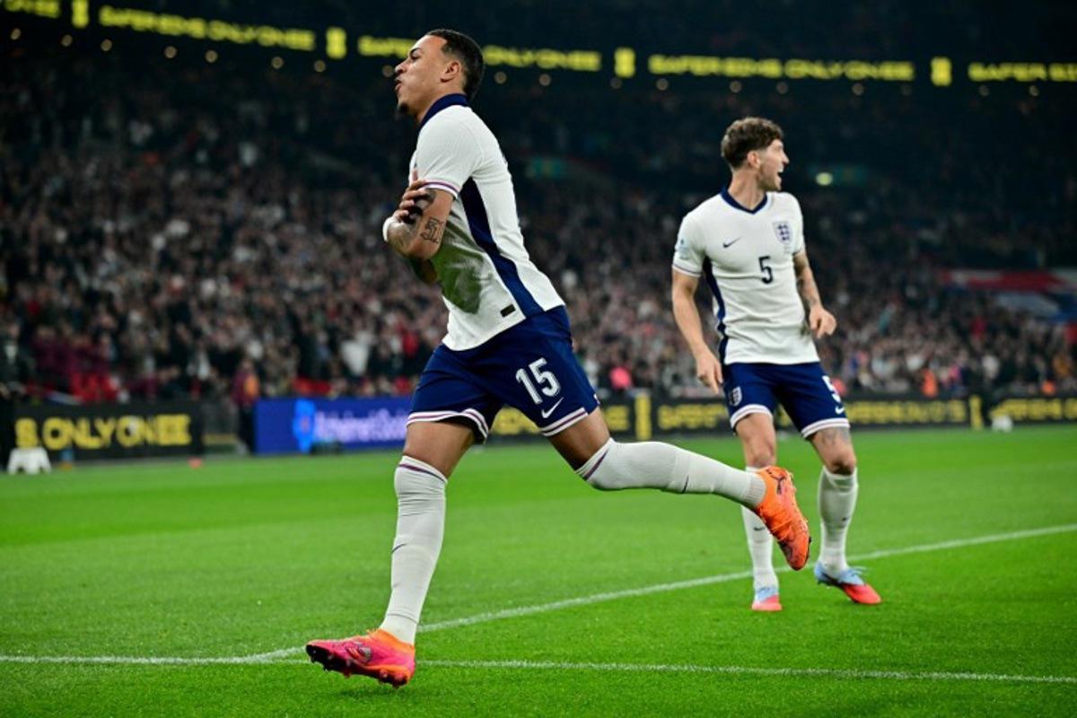 England striker Morgan Rogers celebrates scoring the team's first goal during the friendly football match between England and Wales at Wembley Stadium in London on October 9, 2025. Ben STANSALL / AFP