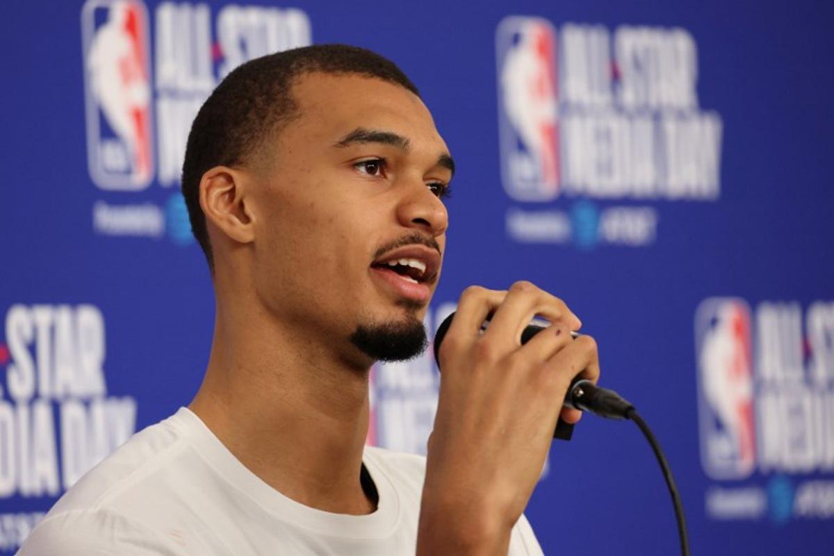 French basketball player Victor Wembanyama of the San Antonio Spurs speaks to the media during the NBA All-Star media day at the Intuit Dome in Inglewood, California, on February 14, 2026. Patrick T. Fallon / AFP