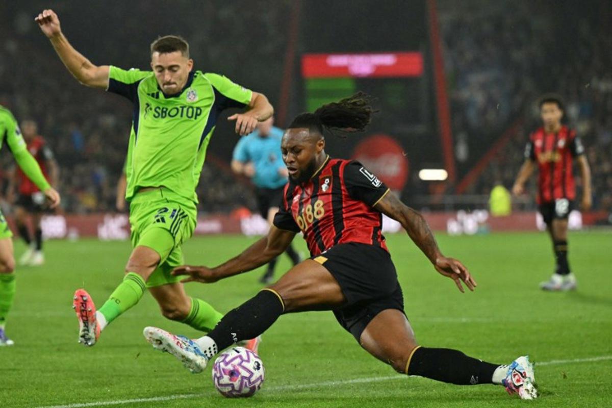 Fulham's Belgian defender #21 Timothy Castagne (L) vies with Bournemouth's Ghanaian striker #24 Antoine Semenyo (R) during the English Premier League football match between Bournemouth and Fulham at the Vitality Stadium in Bournemouth, southern England on October 3, 2025. Glyn KIRK / AFP