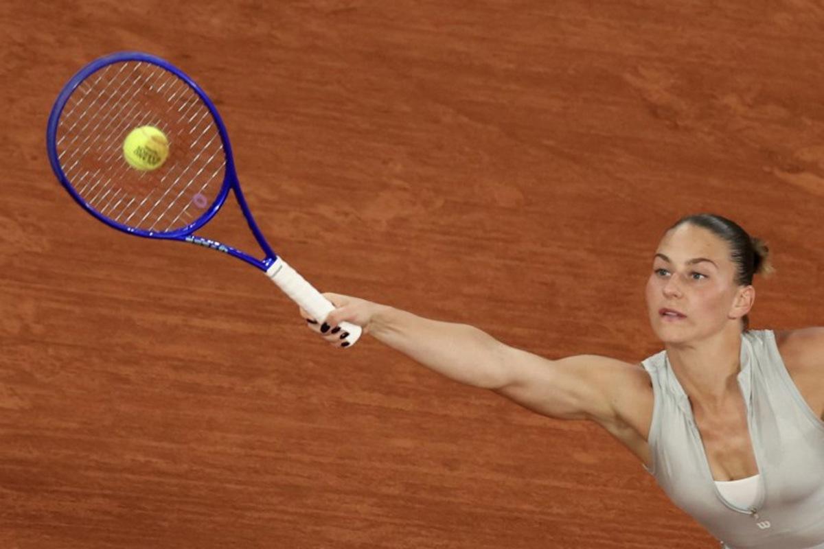Ukraine's Marta Kostyuk plays a forehand return to Ukraine's Elina Svitolina during their women's quarter final singles match on day 10 of the French Open tennis tournament on Court Philippe-Chatrier at the Roland-Garros Complex in Paris on June 2, 2026. ALAIN JOCARD / AFP