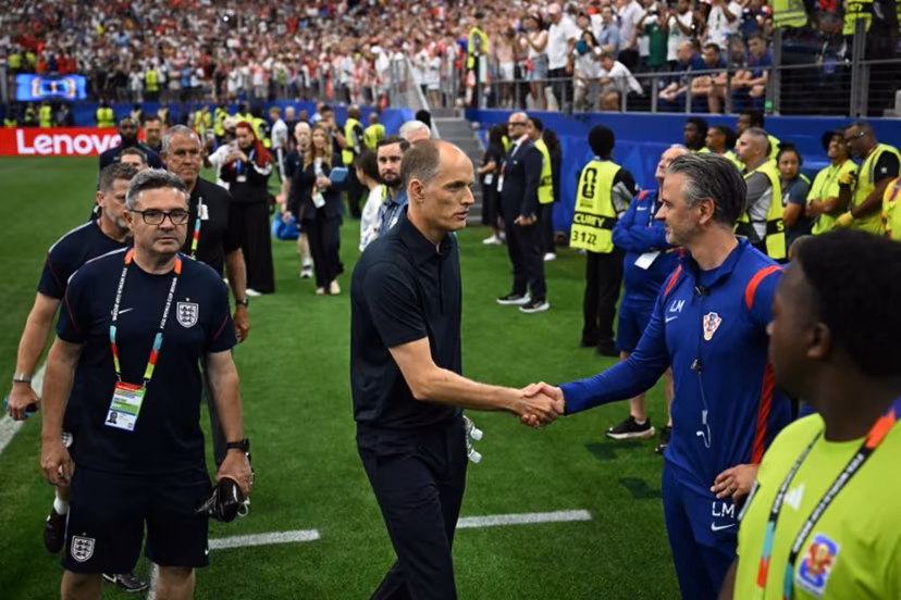 England's German head coach Thomas Tuchel (C) shakes hands with a Croatia staff member as he arrives for the 2026 World Cup Group L football match between England and Croatia at the Dallas Stadium in Arlington on June 17, 2026. Paul ELLIS / AFP