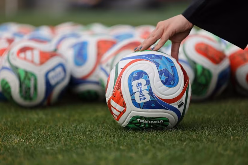 A woman holds a FIFA official World Cup 2026 ball during a training session of the Iranian national football team at their base camp in Antalya on May 19, 2026. Iran's national football team arrived in Turkey on May 19, 2026 for a training camp and to complete visa applications ahead of the 2026 World Cup, AFP correspondents said. Oner SAN / AFP
