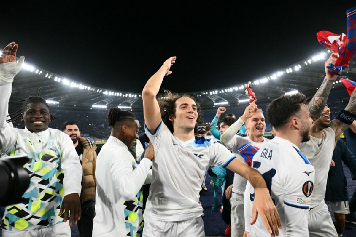 From left : Lazio's French forward #20 Loum Tchaouna, Lazio's French midfielder #08 Matteo Guendouzi, and Lazio's Spanish defender #34 Mario Gila Fuentes celebrate at the end of the EUFA Europa League last 16 second leg football match between Lazio and Viktoria Plzen at the Olympic stadium in Rome, on March 13, 2025. Match ended on 1-1 draw and Lazio qualified for quarter finals. Alberto PIZZOLI / AFP