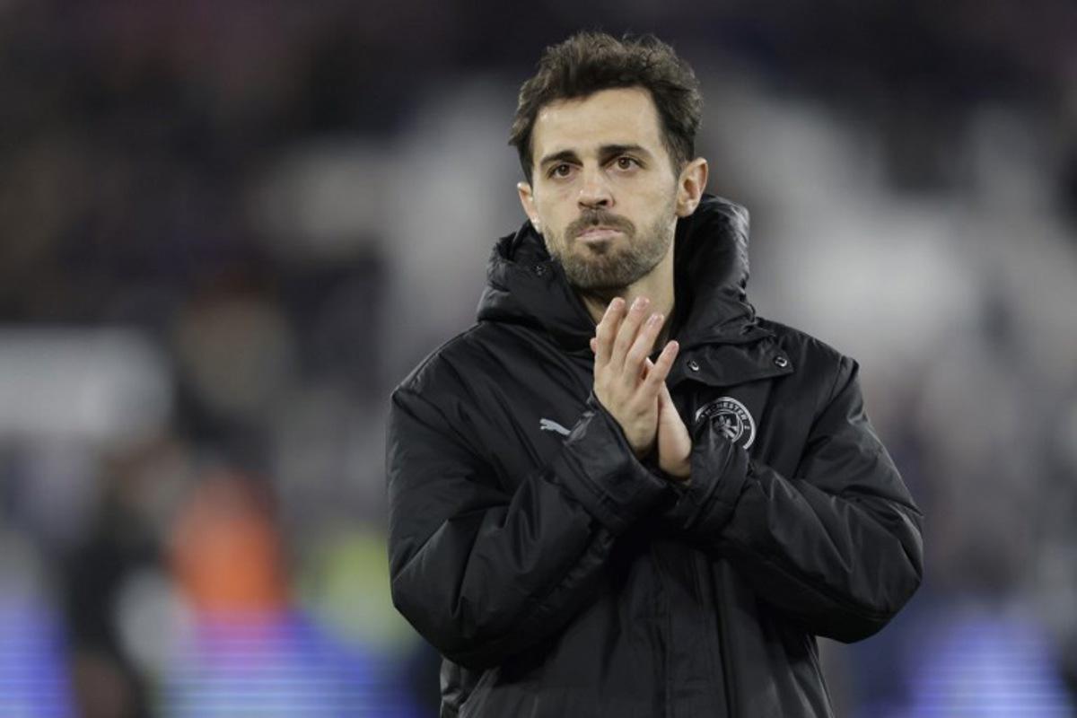 Manchester City's Portuguese midfielder #20 Bernardo Silva applauds fans on the pitch after the English Premier League football match between West Ham United and Manchester City at the London Stadium, in east London on March 14, 2026. The game finished 1-1. Ian Kington / AFP