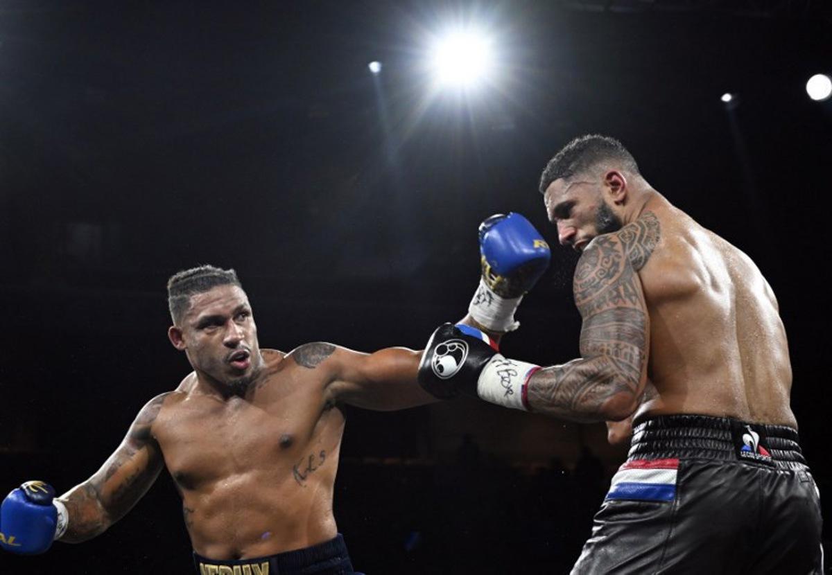 France's Tony Yoka (R) competes against Belgium's Ryad Merhy in their International Heavyweight boxing bout at the Roland Garros complex in western Paris, on December 9, 2023. Miguel MEDINA / AFP