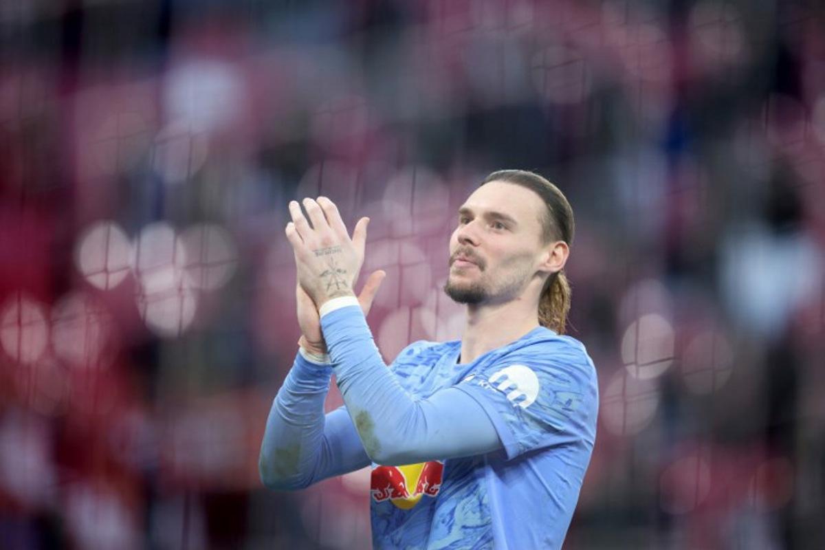 Leipzig's Belgian goalkeeper #26 Maarten Vandevoordt celebrates after the Bundesliga football match between RB Leipzig and Augsburg in Leipzig, eastern Germany, on March 7, 2026. Ronny HARTMANN / AFP