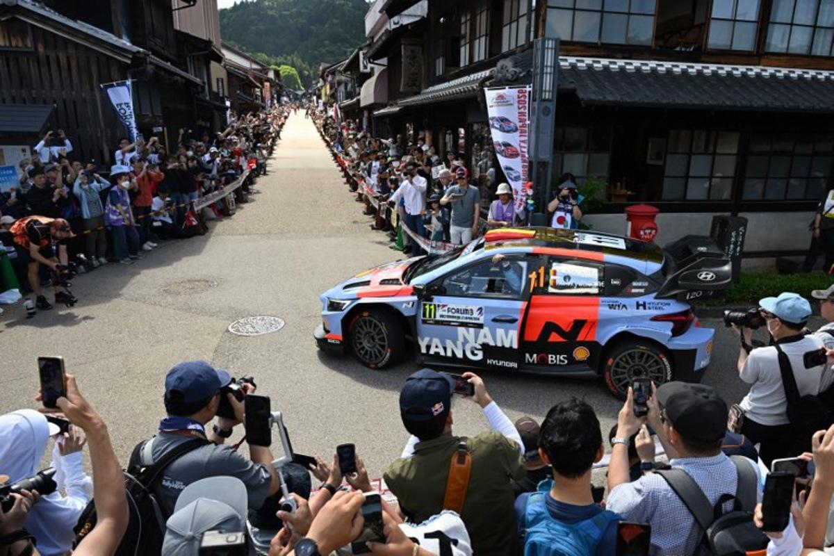 Thierry Neuville of Belgium and his co-driver Martijn Wydaeghe of Belgium drive their Hyundai i20 N Rally1 on the traditional Japanese townscape of Iwamura during the Rally Japan, the 7th round of the FIA World Rally Championships in Ena city, Gifu prefecture on May 30, 2026. Toshifumi KITAMURA / AFP